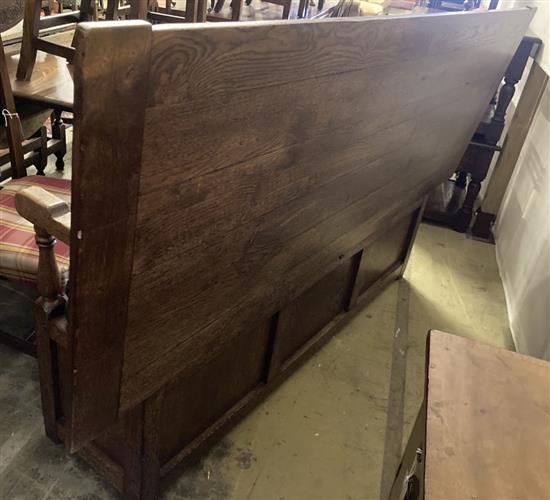 An 18th century style oak monks bench / hall table, width 199cm, depth 72cm, height 117cm